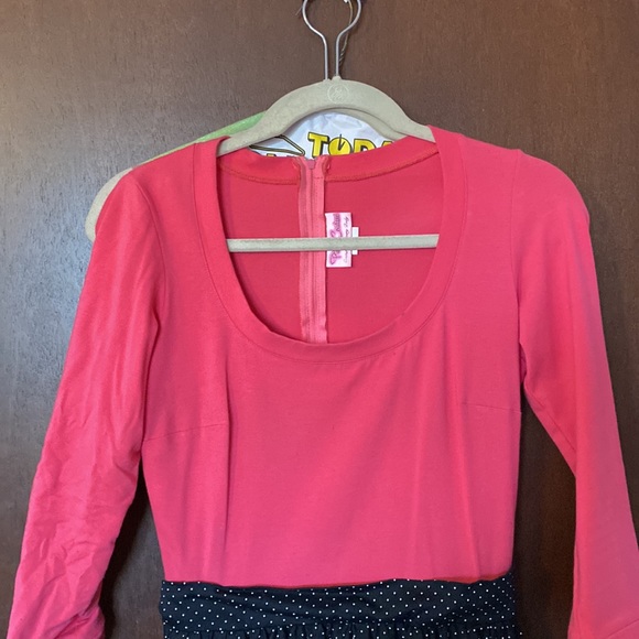 Pinup girl clothing is dress with pink too and black and polka dot skirt - Picture 3 of 5